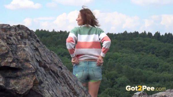 Pretty girl takes a piss while out walking in the country - sexu.com on v0d.com