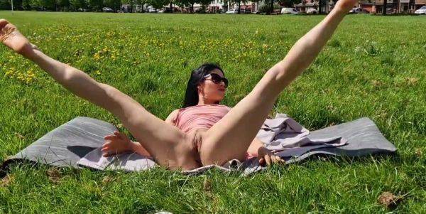 Brunette milf flashing pussy and pissing in a public park - anysex.com on v0d.com