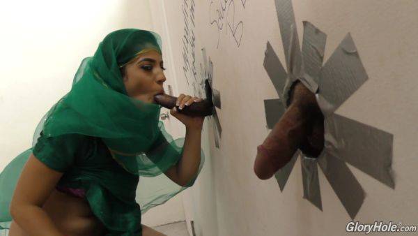 Arab babe tries pair of big cocks through the glory hole until the last drops - hellporno.com on v0d.com