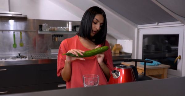 A cute girl peels a cucumber for her older man in a sensual scene. - alphaporno.com on v0d.com
